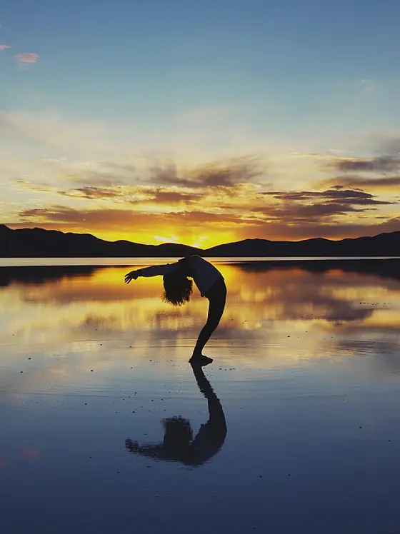 Yoga at sunset by the water